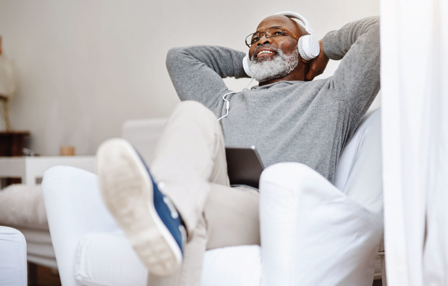 Senior man listening to headphones