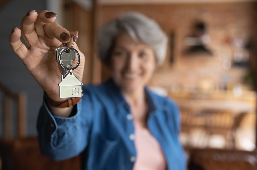 senior woman holding keys