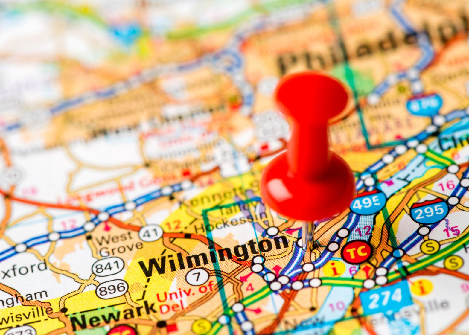 push pin marking Wilmington, Delaware on a map.