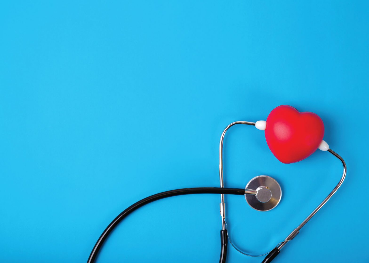 red heart between stethoscope